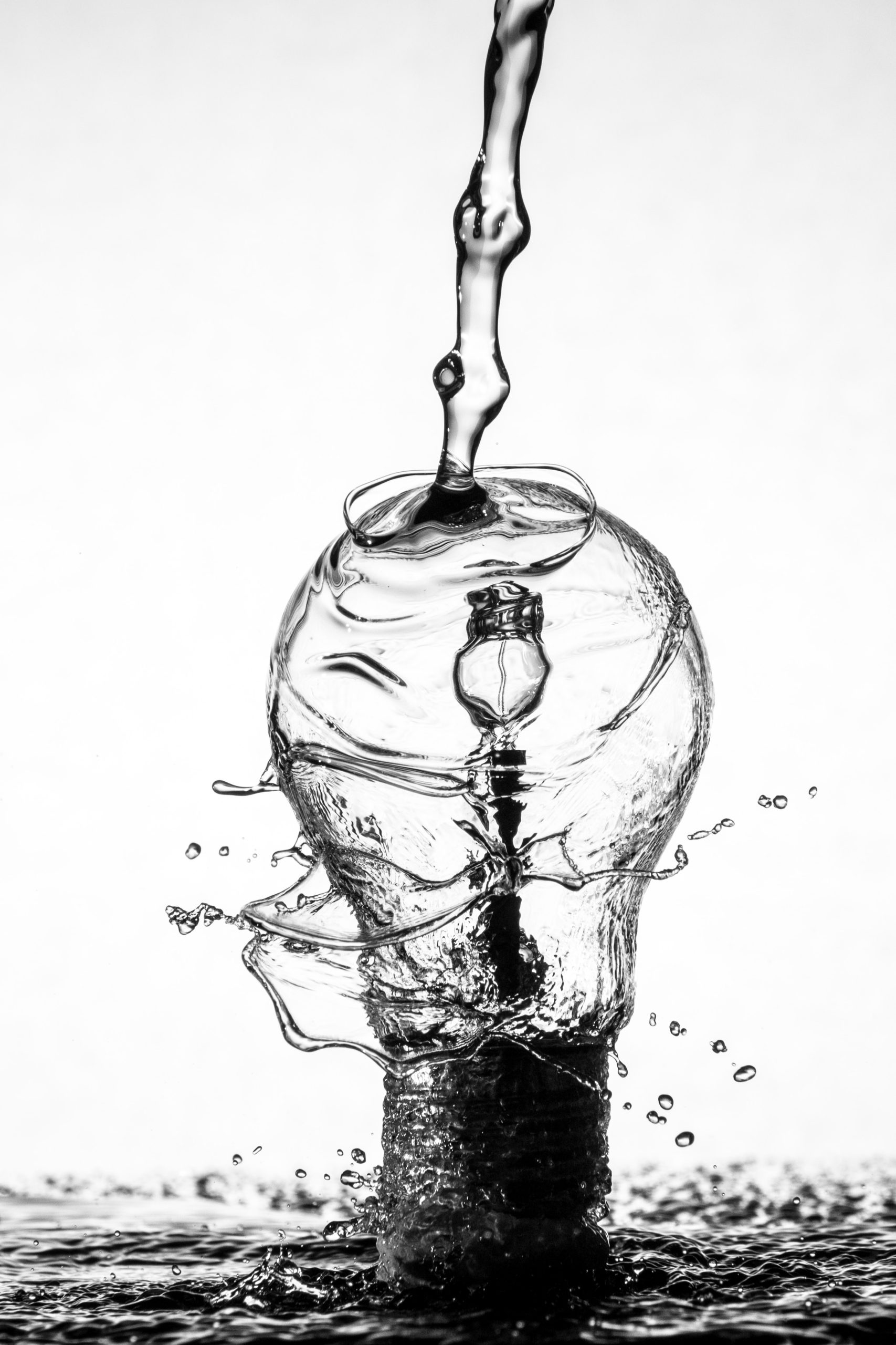 Water dropping on light bulb photo